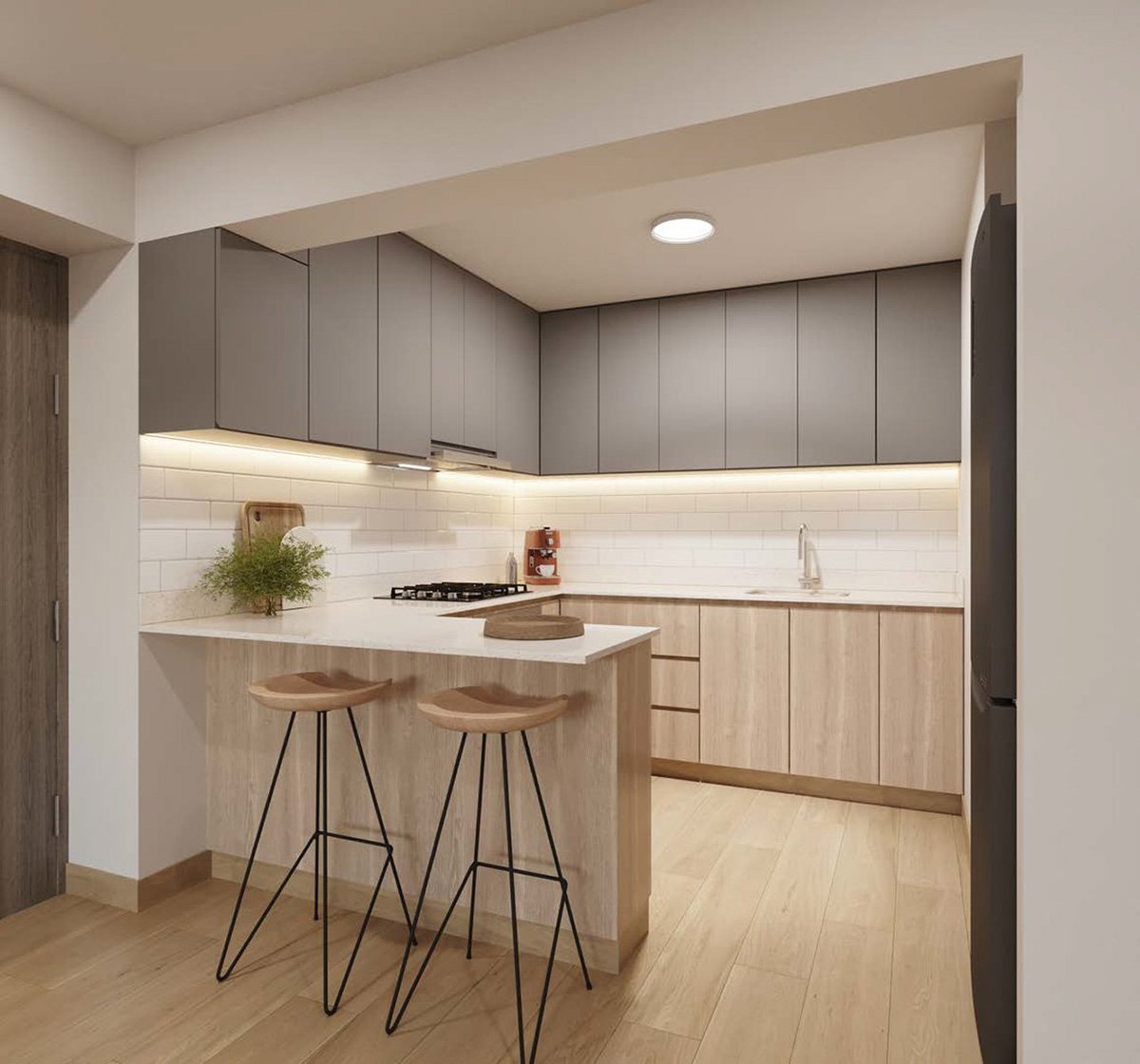 Modern kitchen with gray upper cabinets, light wood lower cabinets, white tile backsplash, and island with bar seating