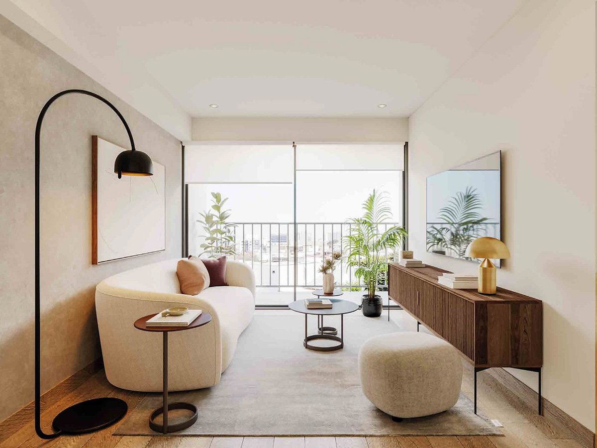 Modern bedroom with curved cream furniture, arc floor lamp, wooden dresser, and balcony access overlooking green plants