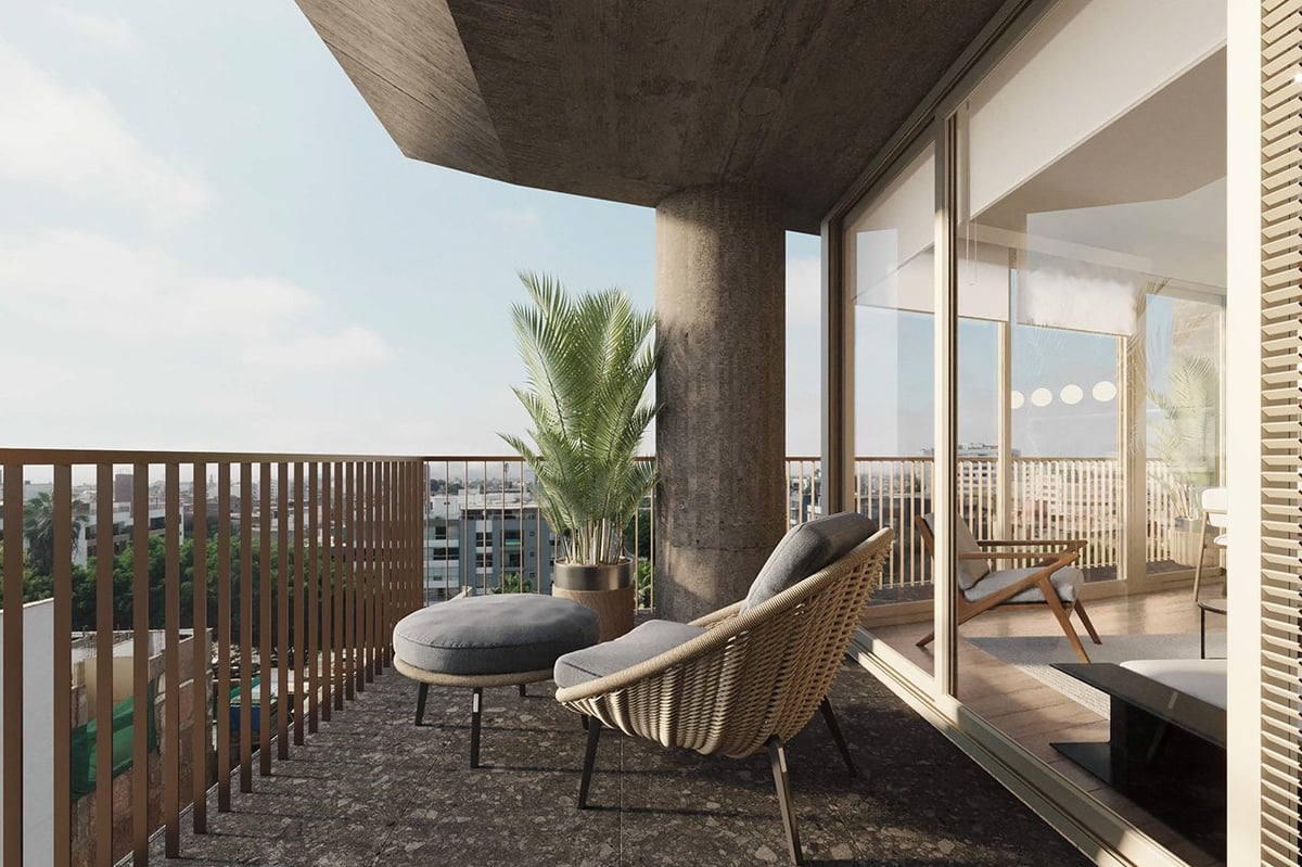 Modern rooftop terrace with lounge chair, potted palm tree, and city views through glass doors