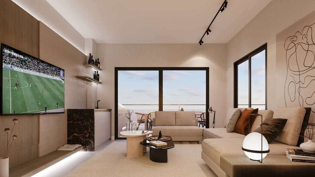 Modern living room with beige sofa, wall-mounted TV showing soccer match, panoramic windows with city view, and minimalist decor.