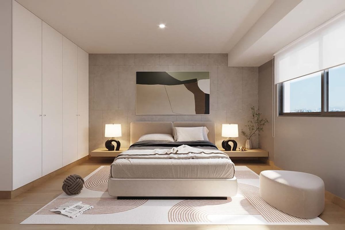 Modern minimalist bedroom with beige platform bed, built-in nightstands with lamps, white cabinetry, and geometric wall art