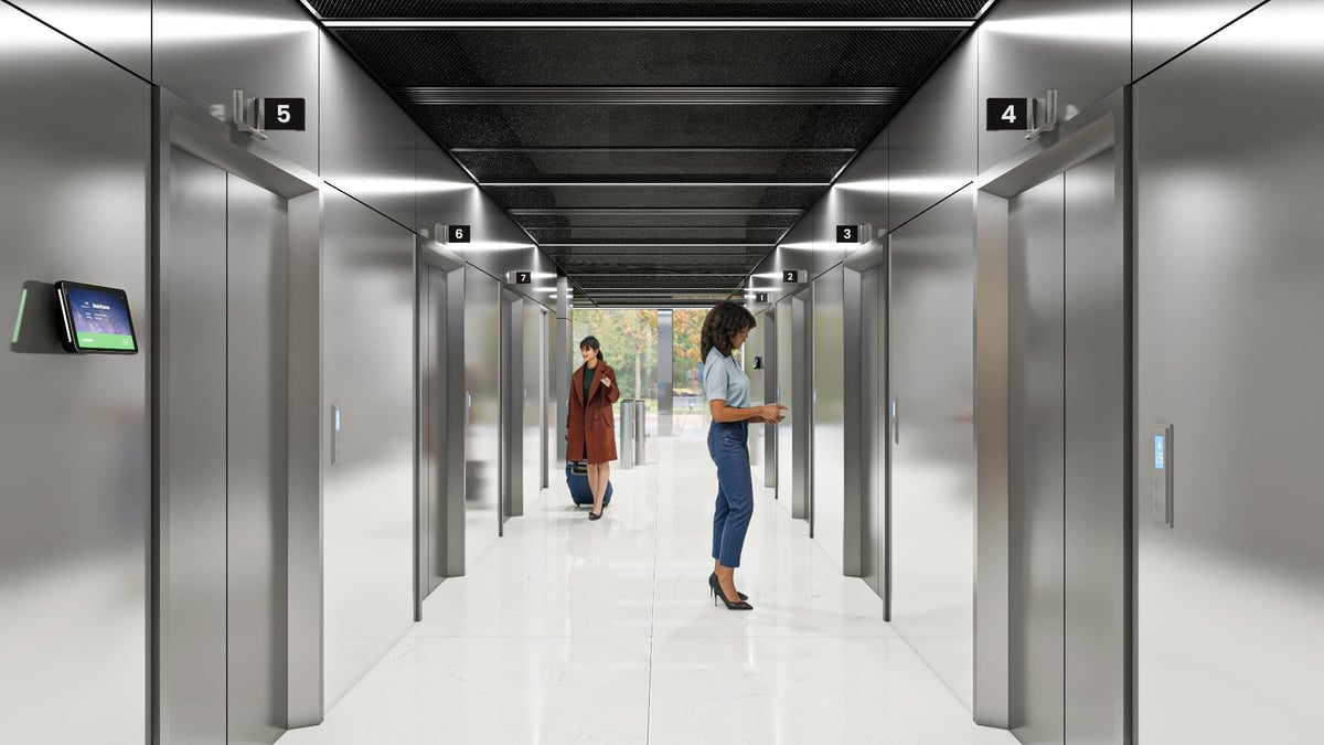 Modern elevator lobby corridor with multiple steel doors, bright fluorescent lighting, and people walking through a clean, minimalist hallway