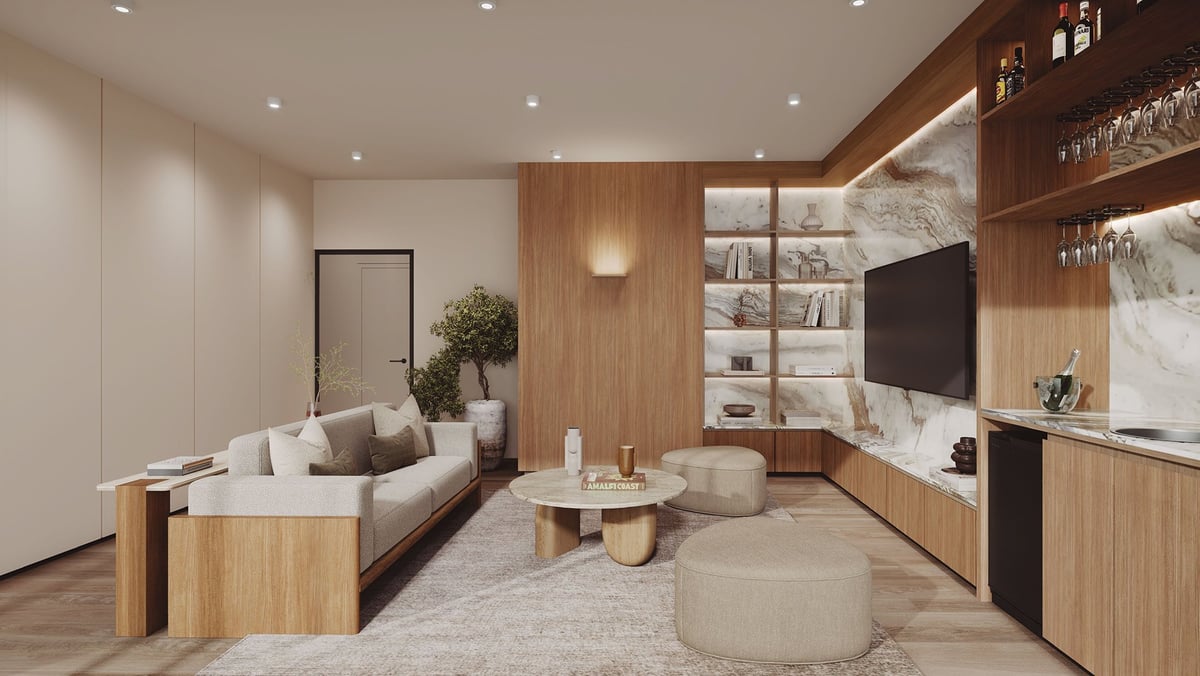 Modern living room with wood cabinetry, beige sofa, round coffee tables, wall-mounted TV, and neutral decor
