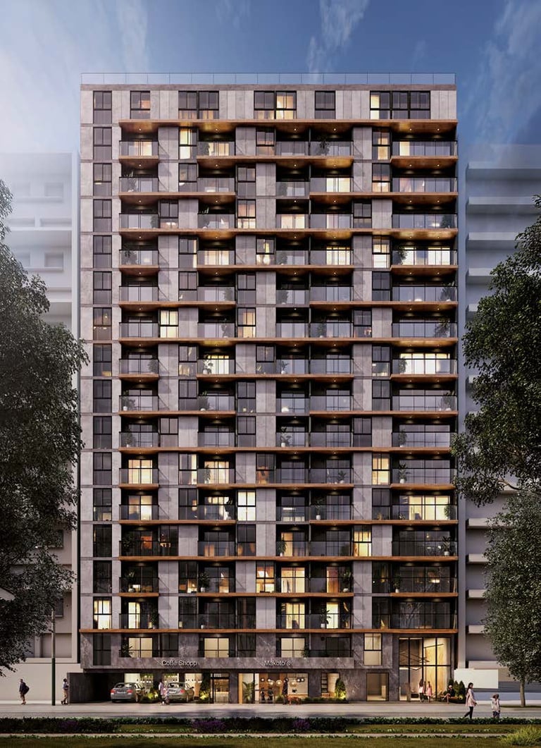 Modern residential high-rise apartment building with illuminated windows and wooden balconies at dusk, flanked by green trees