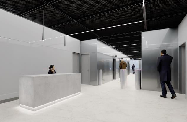 Modern office interior with white walls, polished floor, and industrial ceiling. Receptionist desk on left with staff, businesspeople in hallway.