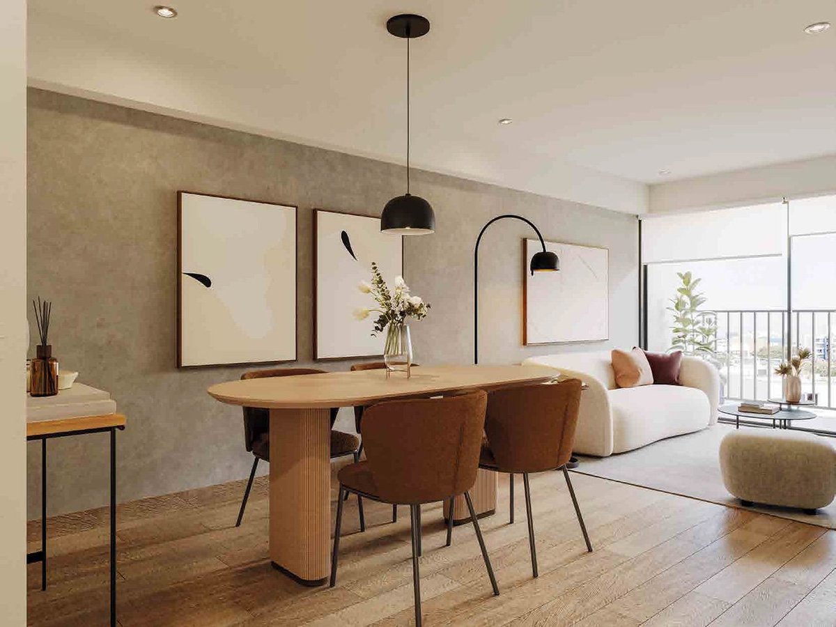 Modern dining room with wooden table, brown leather chairs, pendant lights, and framed wall art overlooking a balcony