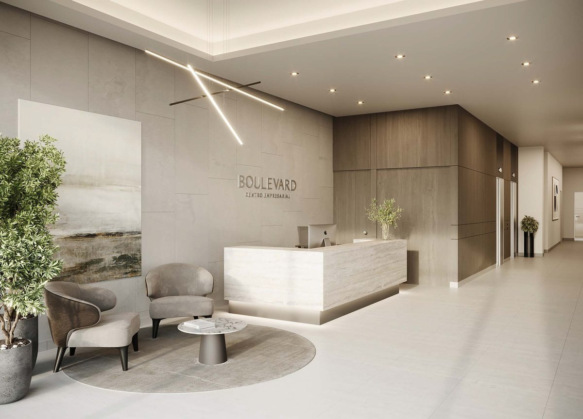 Modern hotel lobby with white reception desk, beige seating, wood paneling, and minimalist décor