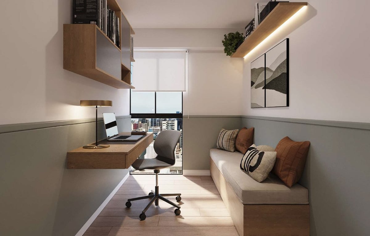 Modern compact home office with desk, chair, window, floating shelves, and sofa seating area against beige and gray walls