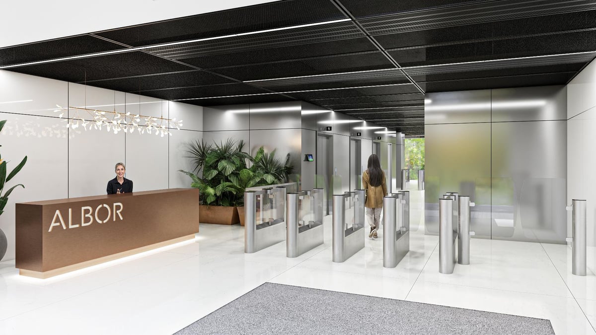 Modern office lobby with Albor reception desk, automated glass doors, and contemporary interior design with plants and minimalist decor