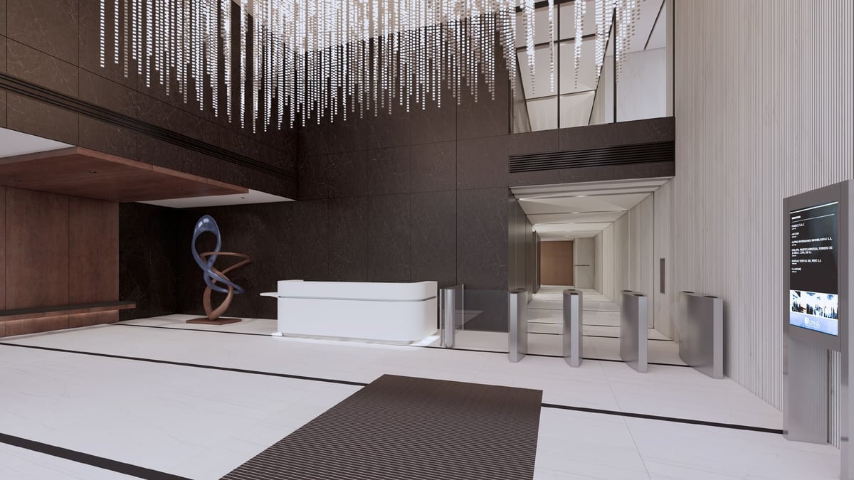 Modern hotel lobby with white reception desk, dark accent walls, hanging light fixture, and contemporary architectural design