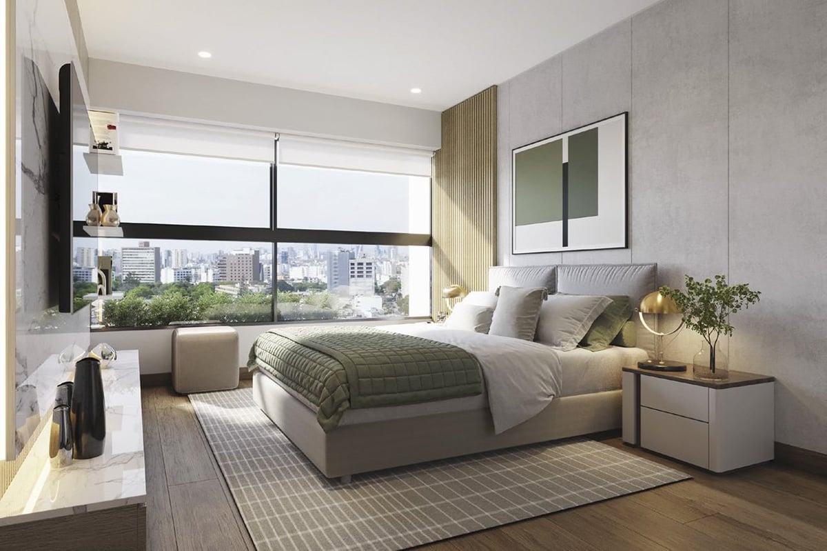 Modern bedroom with gray upholstered bed, large windows overlooking city skyline, wall-mounted TV, and contemporary furnishings