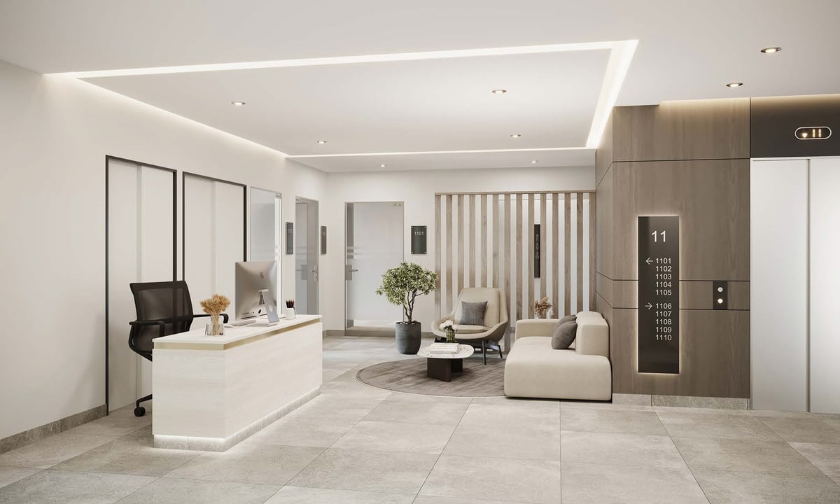 Modern minimalist office lobby with white reception desk, beige lounge seating, floor-to-ceiling mirrors, and contemporary elevator