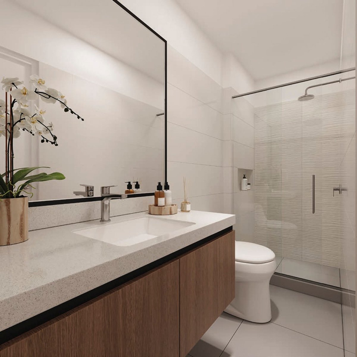 Modern bathroom with white tile walls, wooden vanity, large mirror, walk-in shower, and potted orchid on counter