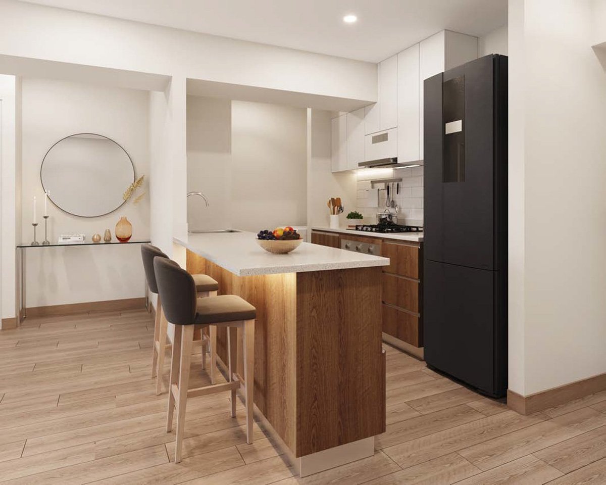 Modern kitchen and bathroom interior with wood island, black appliances, bar seating, and minimalist design