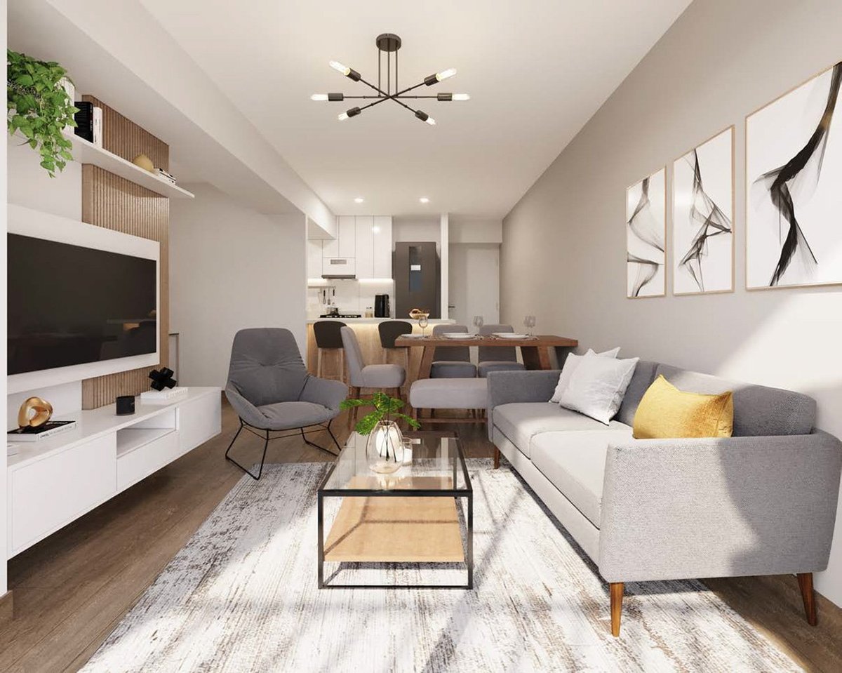 Modern living room with gray sofa, accent chair, TV unit, wood coffee table, and artwork on walls