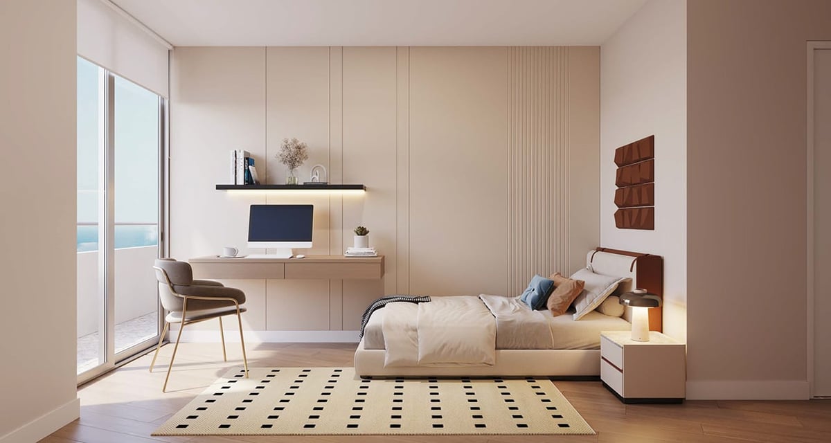 Modern bedroom interior with bed, desk, chair, geometric floor rug, and neutral color palette