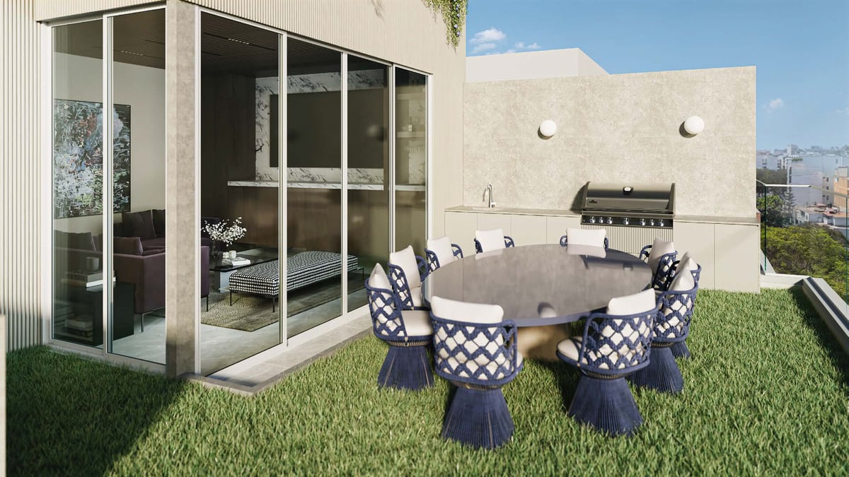 Modern rooftop terrace with blue and white checkered patio set on grass, adjacent to contemporary building with large glass doors