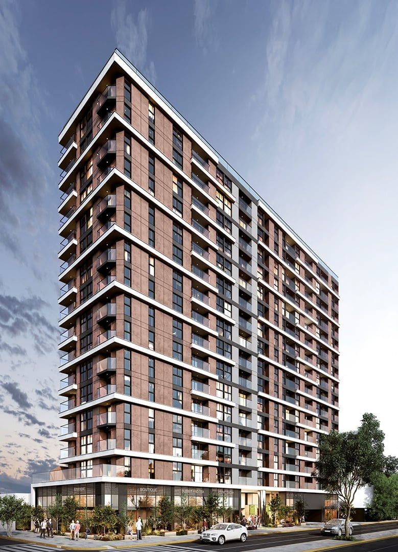 Modern residential high-rise apartment building with brown brick facade, ground-level retail space, and white trim against blue sky