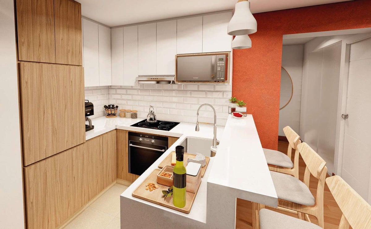 Modern kitchen interior design with wood cabinetry, white countertops, island seating, and coral accent wall.