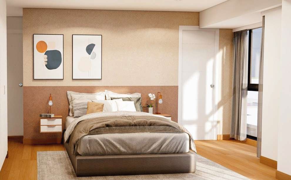 Modern bedroom with brown upholstered headboard, tan bedding, wooden nightstands, abstract wall art, and hardwood flooring