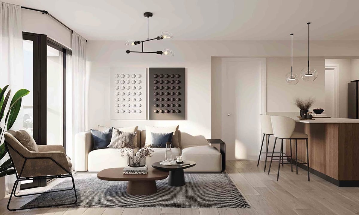 Modern minimalist living room with beige sofa, wooden furniture, pendant lights, and contemporary wall art.
