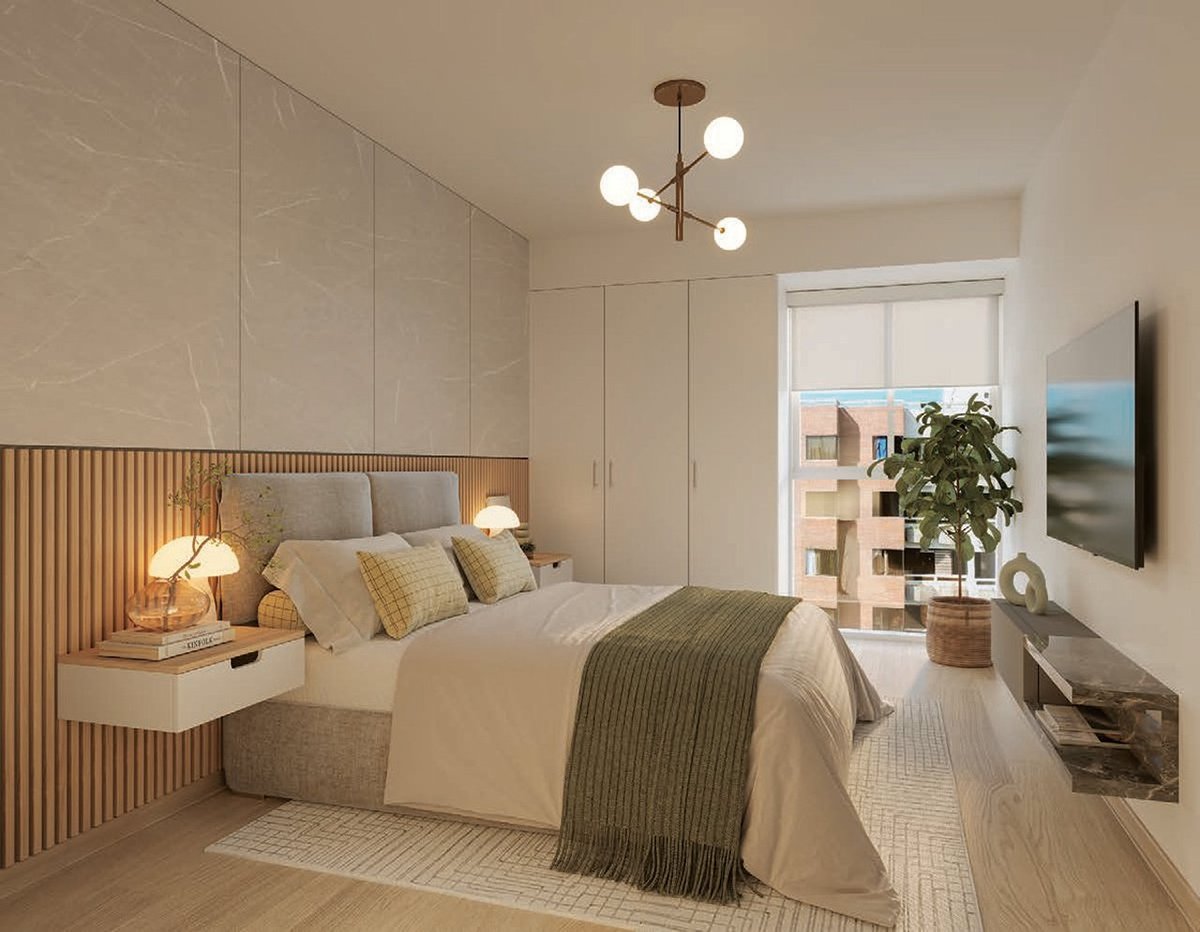 Modern bedroom with beige bedding, wood-slat headboard, pendant lighting, wall-mounted TV, and floor-to-ceiling wardrobe