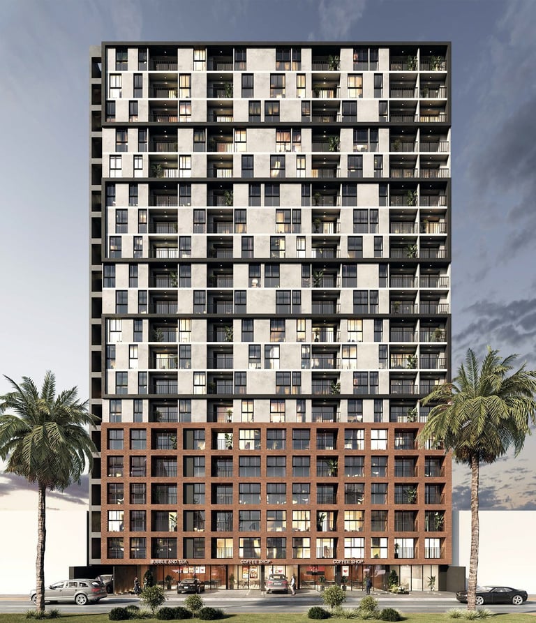 Modern apartment building with two-tone facade of cream and black upper floors, brick base, palm trees, and street-level parking