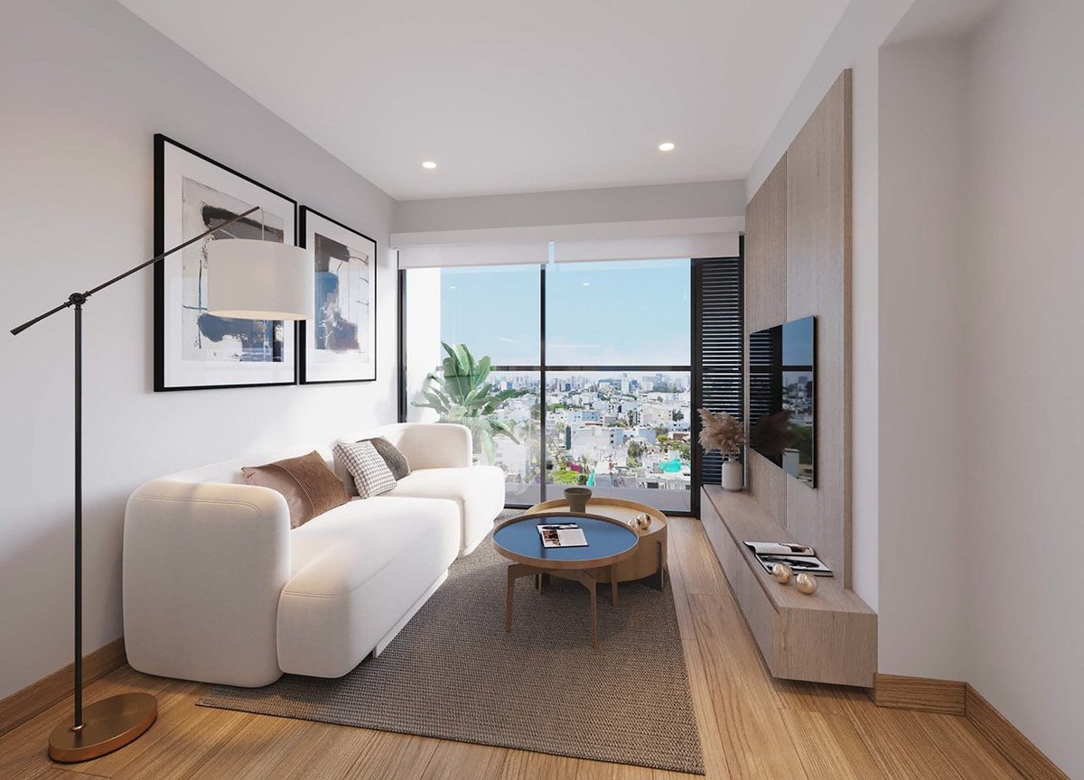 Modern studio apartment with white curved sofa, blue side table, floor lamp, wall art, and floor-to-ceiling windows overlooking a city skyline
